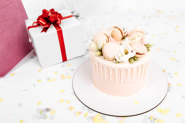beautiful cake, decorated with flowers, boxes with gifts, for birthday, on a white isolated background