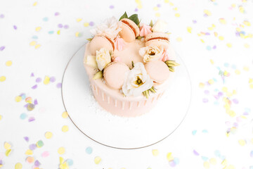White beautiful cake decorated with flowers, birthday and wedding cake, on isolated white background