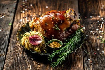 Traditional German cuisine, Schweinshaxe roasted ham hock, Bavarian grilled pork knuckle with...
