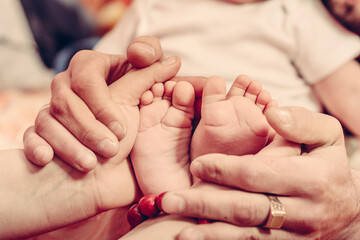 Baptism of a baby, close up of tiny baby feet, sacrament of baptism.