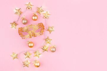 Bright carnival festive background with golden sparkle venetian masquerade mask, decorations,...