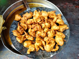 Pune, Maharashtra India- November 21 2020: A mouth watering pakora with hot tea.