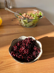 Wild Rice. Black Rice with Tuna Fish Salad Healthy Organic Sporty Athlete Food. Forbidden Rice and Orange Juice.