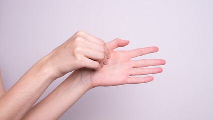 Parkinson's disease symptoms. Close up of tremor (shaking) hands of Middle-aged women patient with Parkinson's disease. Mental health and neurological disorders.