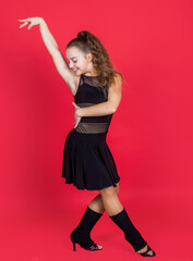 girl child adorable ballroom dancer wear black dress in dance pose, ballroom dancer