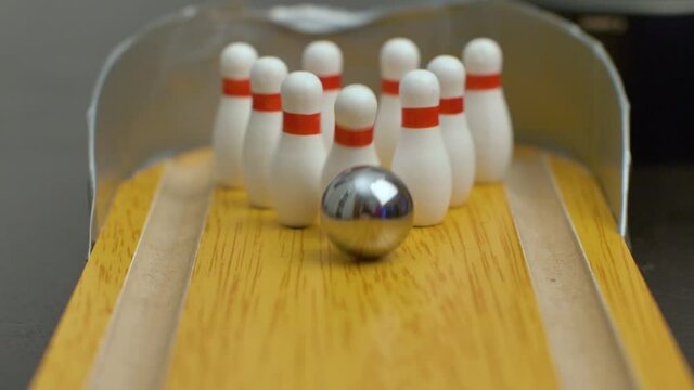 Bowling ball on the track in order to knock down the pins
