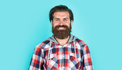 stylish bearded guy with trendy hairstyle wear checkered shirt, beauty