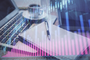 Double exposure of forex chart drawing and desktop with coffee and items on table background. Concept of financial market trading