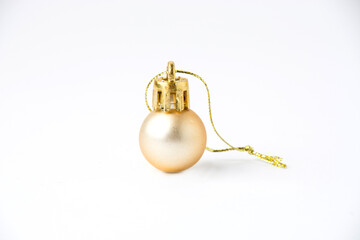 Christmas decor small shiny golden ball on white background