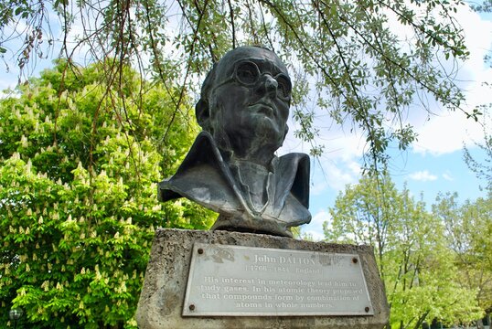 The Bust of John Dalton against blue sky with English explanation plate at METU greenery park. Dalton is an English scientist, best known for introducing the atomic theory into chemistry. 