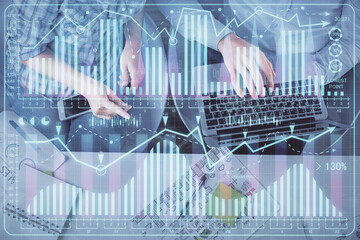 Multi exposure of man and woman working together and forex graph hologram drawing. Financial analysis concept. Computer background. Top View.