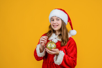 Thank you. child santa helper in costume. party fun. prepare for winter holiday. happy new year. merry christmas. cheerful teen girl celebrate xmas party. kid wear red hat hold tree decoration