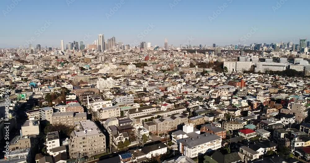 Wall mural Populated city urban areas of Tokyo near Shimakitazawa to Shinjuku as 4k.

