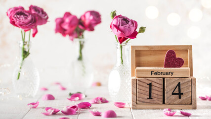 February 14 calendar, roses and rose petals. The concept of Valentine's Day.