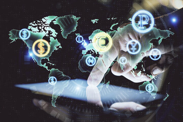 Double exposure of man's hands holding and using a digital device and forex graph drawing. Financial market concept.