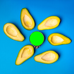 Yellow mango on a blue background with a place under the logo