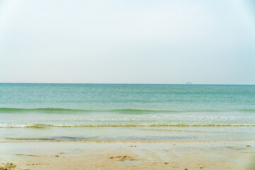 Sea and sand under a blue sky