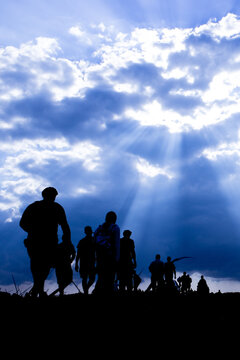 Silhouette of the emigrants on the way