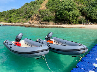 Inflatable boats tie with floating pier