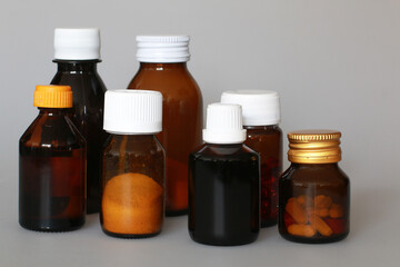dark-colored medical bottles for storing tablets, capsules, powders, syrup