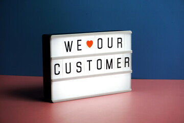 We love our customer word in light box business concept background