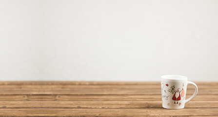 New Year's cup On a wooden table. Santa