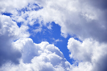 Naklejka na ściany i meble background of clouds over blue sky. concept clearing against bad weather