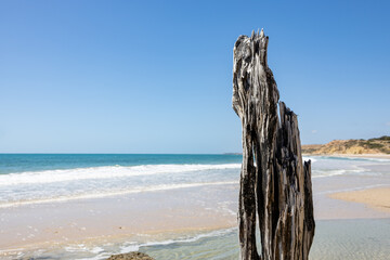 The eroded jetty post with the beach selectively blurred at Port Willunga South Australia on December 8th 2020