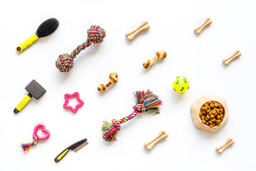 Pet toys accessories for dogs and cats on white background, top view
