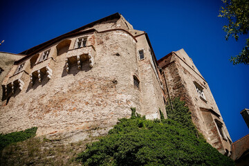 Fototapeta na wymiar Gothic imposing historic castle Pernstejn at sunny summer day, stronghold on rock above village of Nedvedice, South Moravian Region, Czech Republic