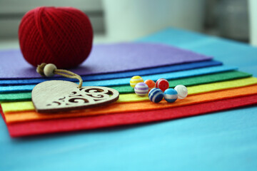 Beads on a colorful felt on a blue background.