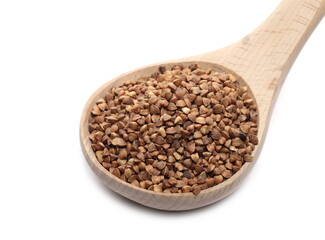 Buckwheat seed pile with wooden spoon isolated on white background