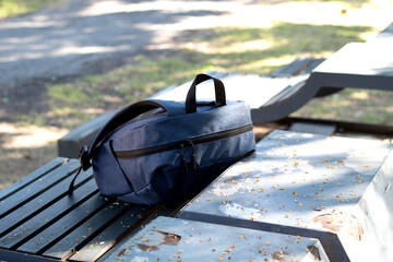 A forgotten shoulder bag left in the park
