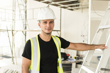 Portrait of young worker wearing hard hat
