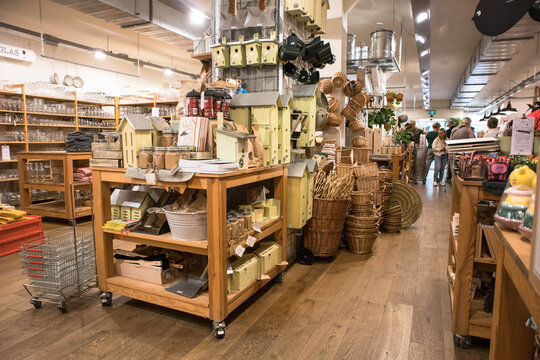 Interior of homewares store showing items for sale in displays.  Birdboxes