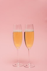 champagne glasses isolated on pink
