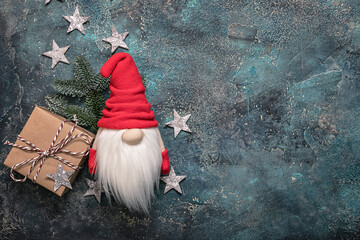 Snow gnome or elf in a red cap. Christmas toy. Blank for a Christmas or New Year card. Copy space