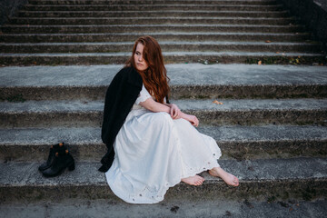 woman in a white dress on a bridge