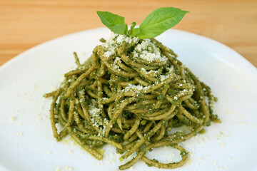 Plate of Tasty and Healthy Homemade Whole Wheat Spaghetti with Pesto Sauce