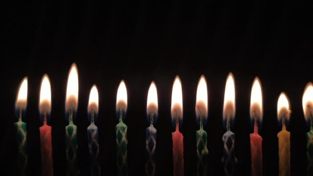 Birthday candles on black background