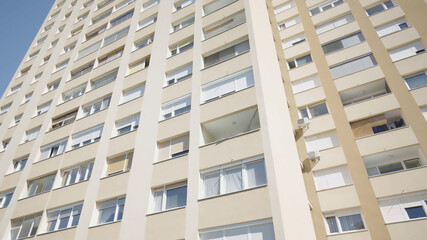 Endless condo apartments tall building under the blue sky 4K