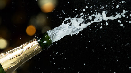Detail of champagne wine splashing from bottle