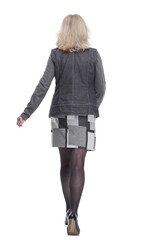 young woman walking away. isolated on a white