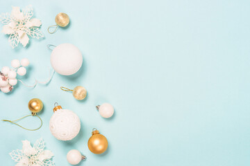 Christmas copmosition with holidays decorations. Flat lay image on blue background.
