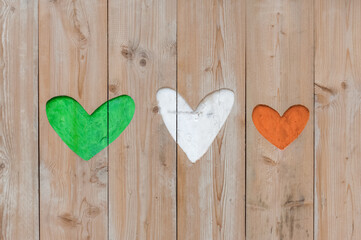 Republic of Ireland flag colors carved into wooden love hearts