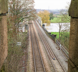 Double train tracks over a river viaduct