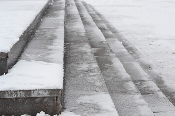 Snow and ice on stairs in winter.