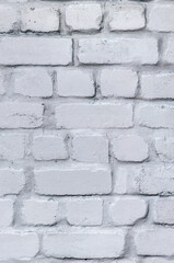 The wall is made of old red baked clay bricks, painted light gray. Vintage texture, urban...