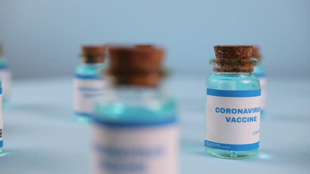New vaccine pfizer and biontech isolated on blue background. Covid-19, 2019-ncov pandemic. Coronavirus inoculation concept. Sars-cov-2. Ready-made preparations with doses