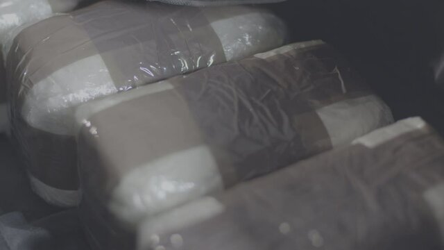 Close up of Cocaine Bags in Black Bag